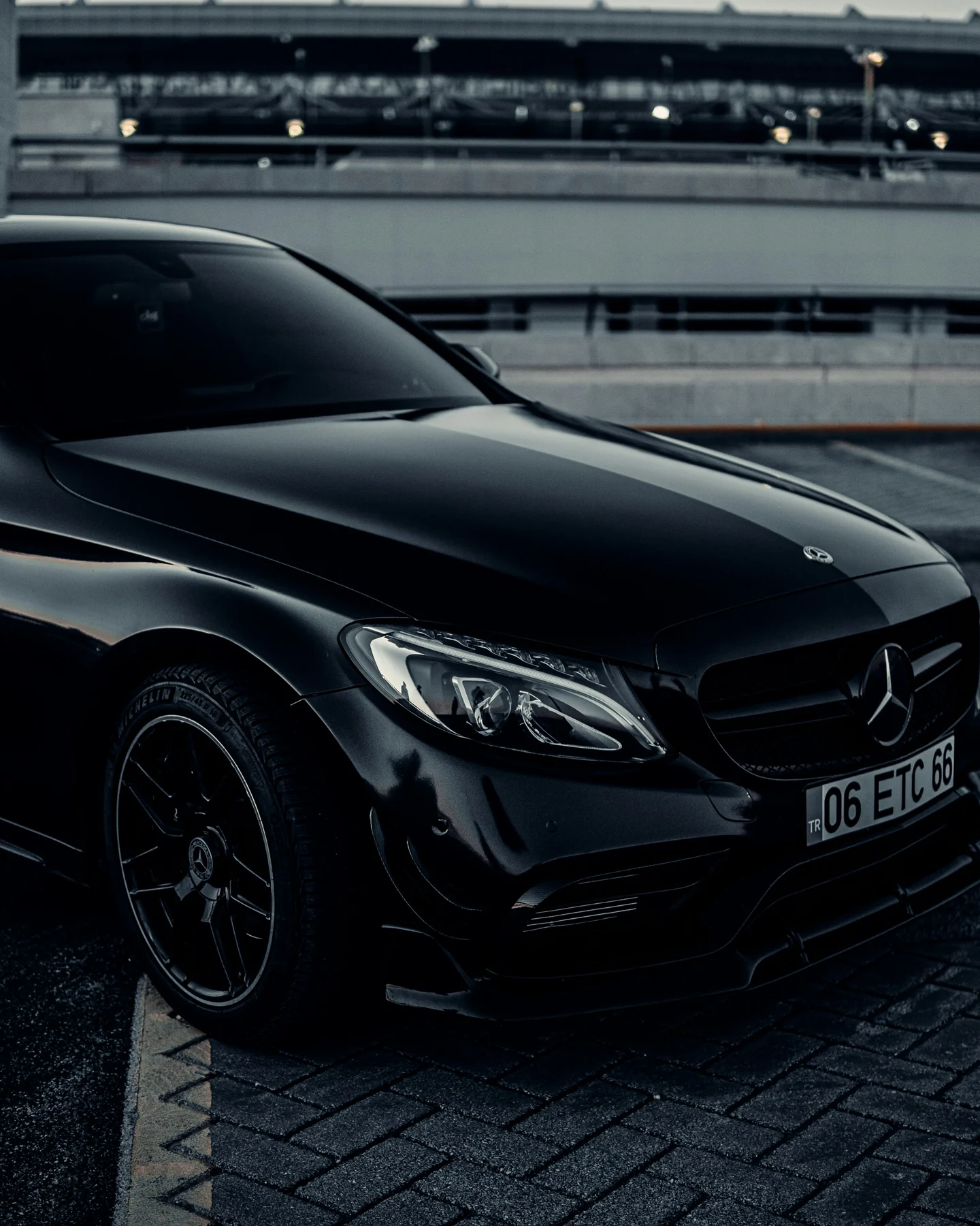 Close-up of a black Mercedes-Benz in an urban setting